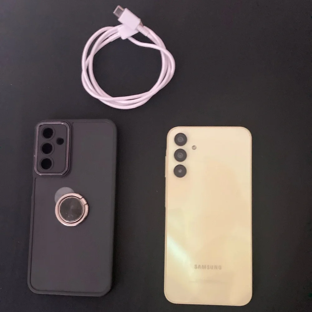 Samsung Yellow Smartphone with Black Case and White Cable